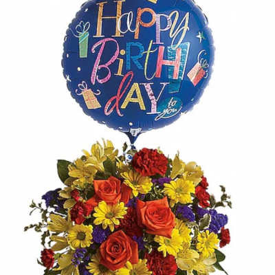 Birthday balloon above a colorful flower arrangement in a blue vase