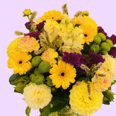 Yellow and purple mixed bouquet in a glass vase