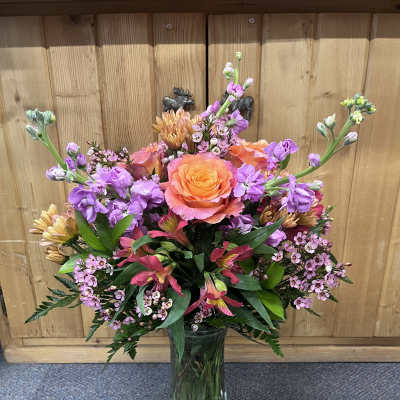 Colorful mixed bouquet in a clear glass vase