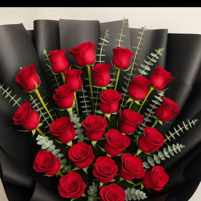 Bouquet of red roses wrapped in black paper with a black ribbon