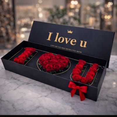 Black gift box with red roses arranged as "I love u"