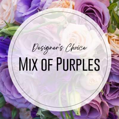 Close-up of a designer's choice bouquet with mixed purple and cream roses and blooms