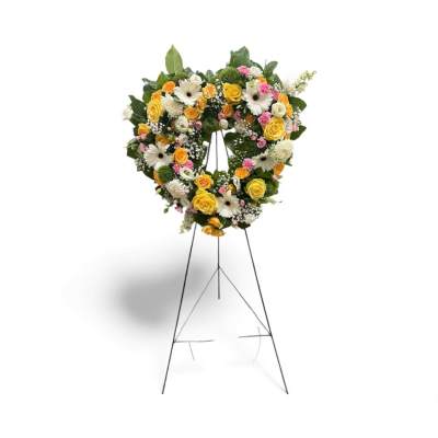 Heart-shaped floral wreath on a standing easel