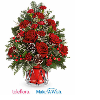 Red roses and carnations in a glass vase with pinecones