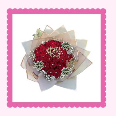 Heart-shaped bouquet of red roses with a Happy Mother's Day topper