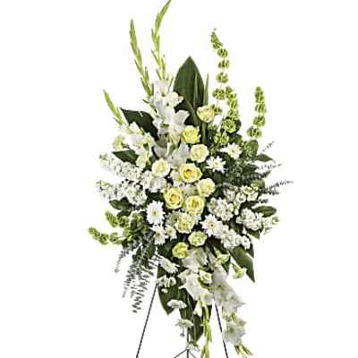Standing floral spray of white and pale yellow flowers on an easel