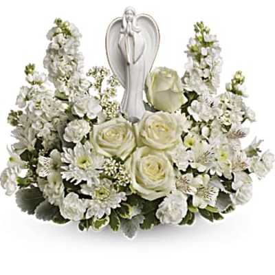 White floral arrangement with roses and a silver angel figurine