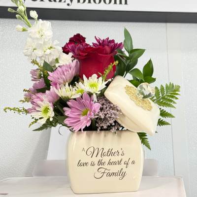 Mixed bouquet in a cream vase with a Mother's Day message