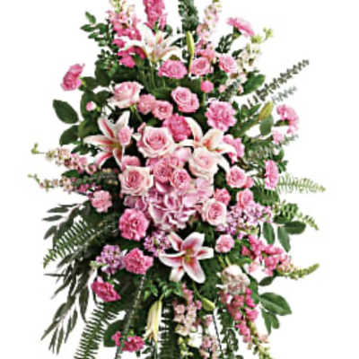 Tall pink floral standing spray on an easel