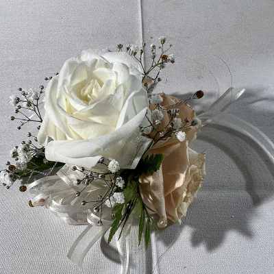 White rose boutonniere with baby's breath and ribbon