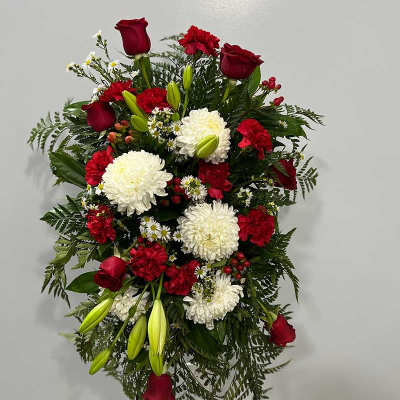 Standing floral spray with red roses, white chrysanthemums, and lilies