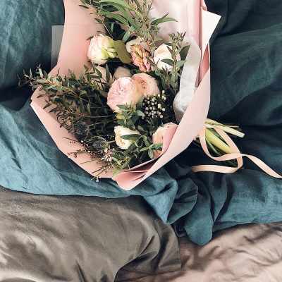 Pink and white bouquet wrapped in blush paper