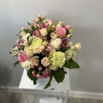 Mixed pink, white, and cream bouquet with roses and carnations