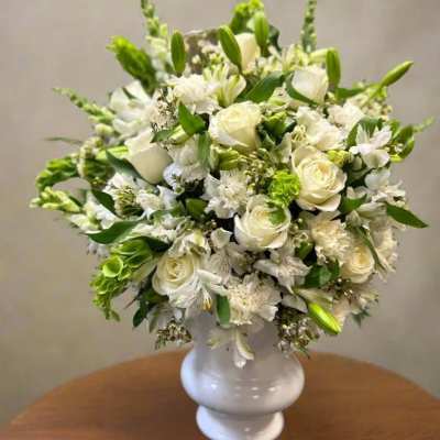 White floral bouquet in a white vase