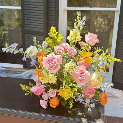 Mixed bouquet of pink, yellow, and orange flowers