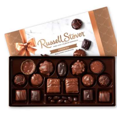 Box of assorted chocolates with a decorative lid