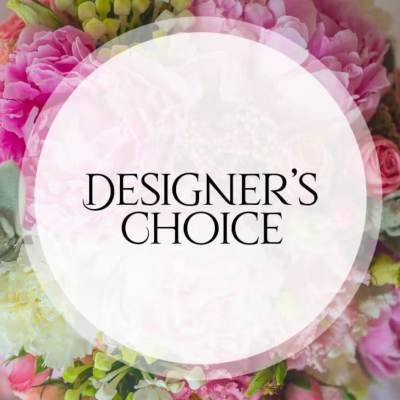 Pink and white floral arrangement with a Designer's Choice label