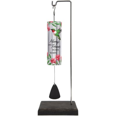 Hummingbird memorial wind chime with floral design on a metal stand with wood base