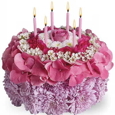 Pink floral cake with lit candles
