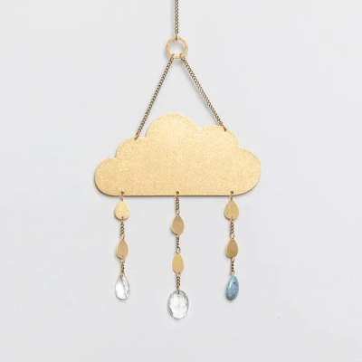 Gold metal cloud wall hanging with dangling raindrop chains and clear and blue teardrop beads