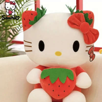Hello Kitty plush holding a strawberry, with a red bow