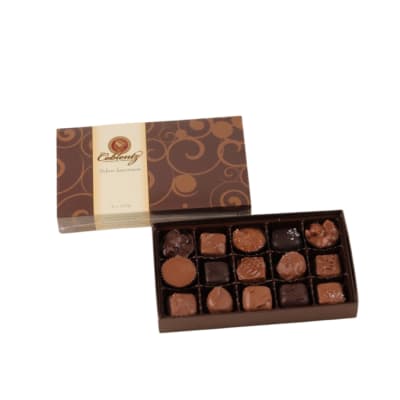 Open box of assorted chocolates with decorative brown and gold lid beside it