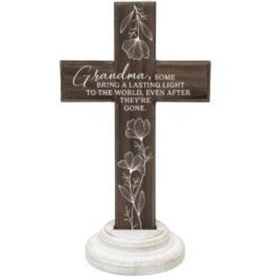 Brown memorial cross for Grandma with white floral engraving on a round white base