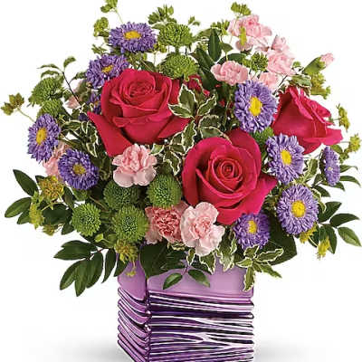Bouquet of pink roses, purple daisies, and green pompons in a purple vase