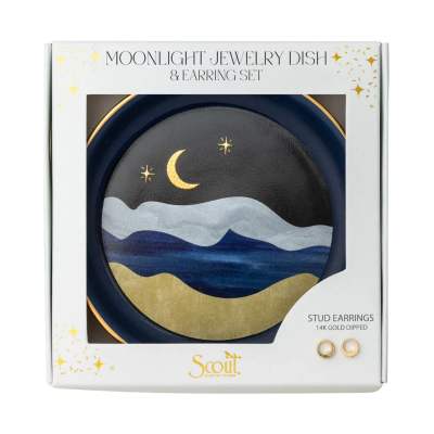 Boxed moonlight-themed round jewelry dish with crescent moon design and small gold stud earrings.