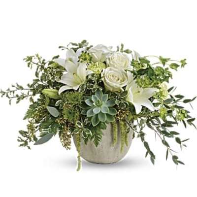 White lilies and roses in a round ceramic vase