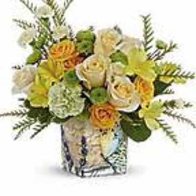 Bouquet of yellow and white flowers in a patterned vase