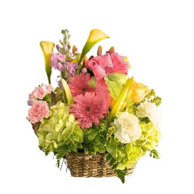 Basket arrangement with pink and yellow flowers and a pink ribbon