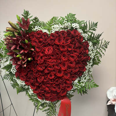 Heart-shaped red rose standing spray with lilies and baby's breath