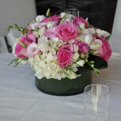 Pink and white rose bouquet in a black round box