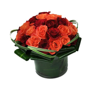 Bouquet of red and orange roses in a dark green container