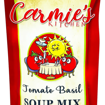 Carmie's Kitchen Tomato Basil Soup Mix pouch with cartoon tomatoes at a table