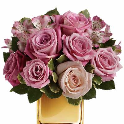 Pink roses and alstroemeria arranged in a gold square vase