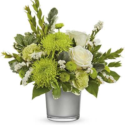 Green and white flower arrangement in a gray vase
