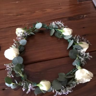 White rose floral crown with eucalyptus and small purple filler flowers