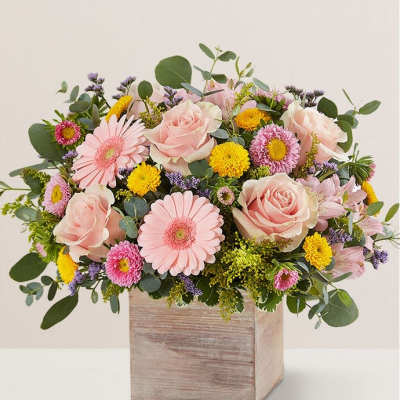 Pink roses and daisies in a wooden box arrangement