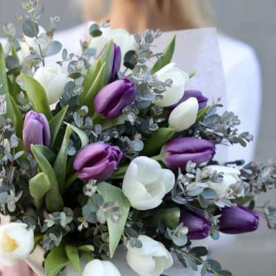 Bouquet of purple and white tulips with eucalyptus