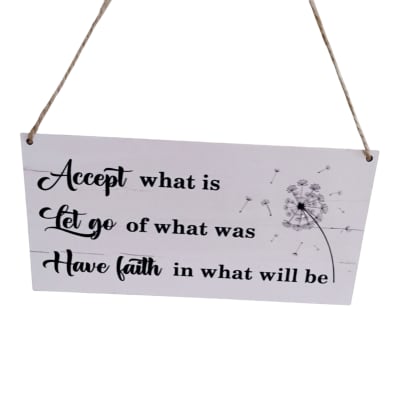 Hanging sign with a motivational quote and dandelion graphic