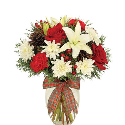 Red roses and white lilies in a glass vase with a plaid bow
