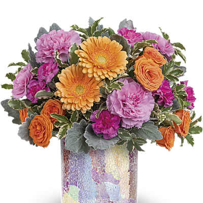 Mixed bouquet of pink, orange, and purple flowers in a mosaic vase