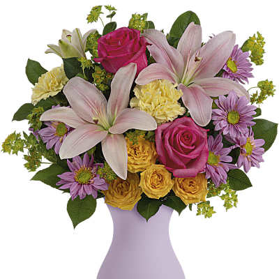 Bouquet of pink lilies, roses, and purple daisies in a lavender vase
