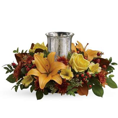 Autumn floral centerpiece with a silver candle holder