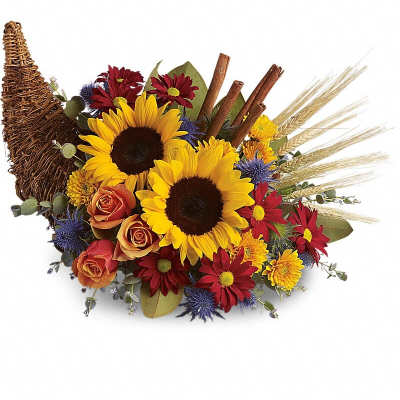 Sunflower and rose arrangement in a wicker cornucopia basket