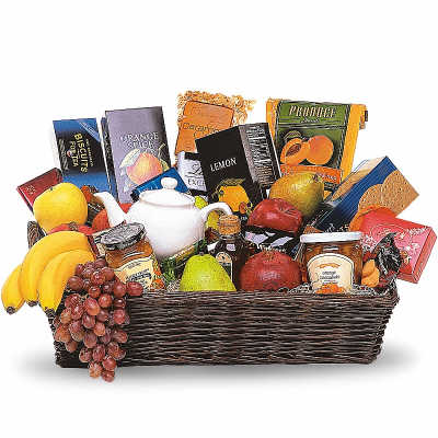 Gift basket with fruit, tea, cookies, and jam in a wicker tray