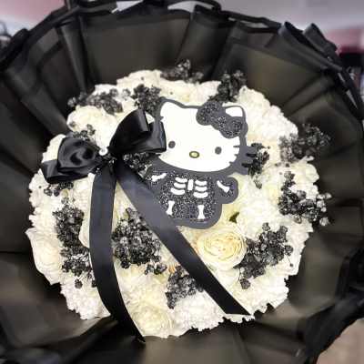 White rose and carnation bouquet with black ribbon and Hello Kitty topper
