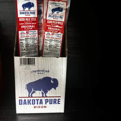 Box of Dakota Pure bison meat sticks in red and white packaging